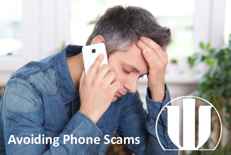 man with cell phone looking upset after phone scam